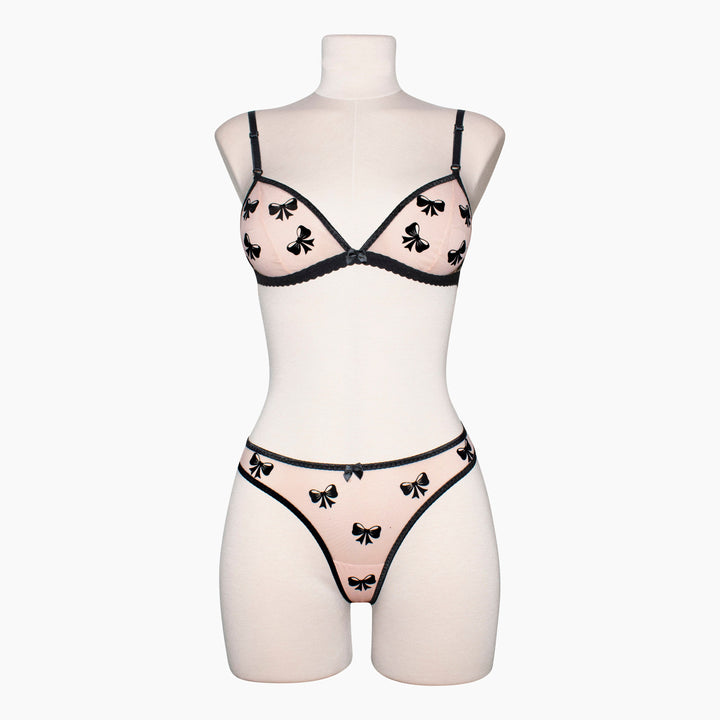 Peach sheer mesh thong with black velvet bow applique