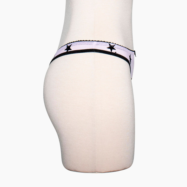Sheer lilac mesh thong with black velvet star appliqué