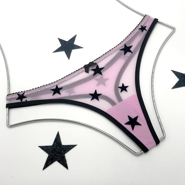 Sheer lilac mesh thong with black velvet star appliqué